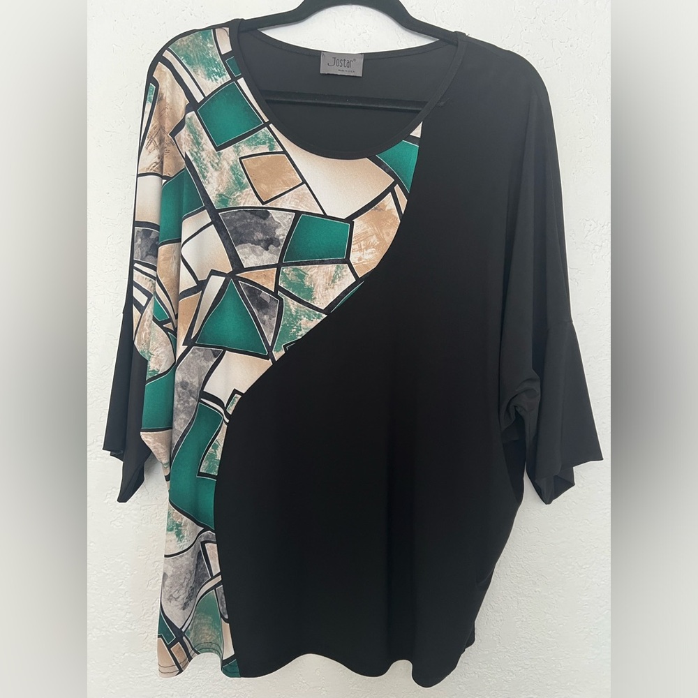 94% Polyester and 6% Spandex Round Neck 1/4 sleeve made in the USA Blouse